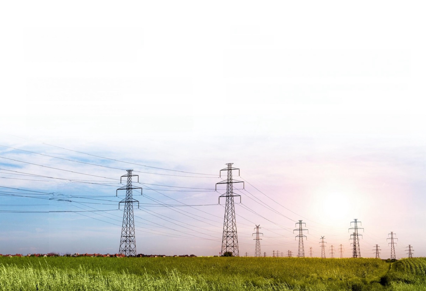 Overhead power transmission towers crossing open fields
